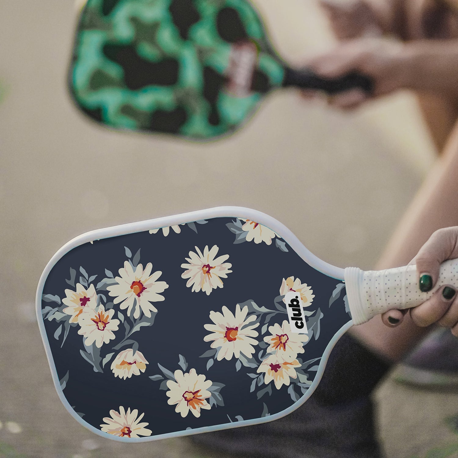floral daisy pickleball paddle with white grip 